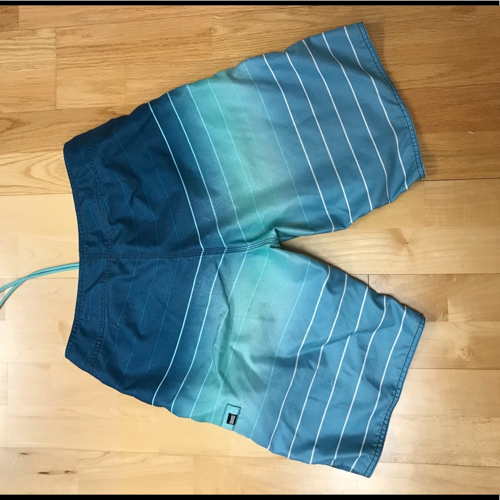 Blue ombre striped swim shorts